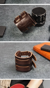 Detail of dark brown leather cuff bracelet with scorpion embossing and buckle