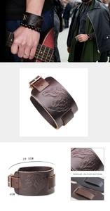 Detailed view of wolf head embossed leather wristband with size markings and metal buckle