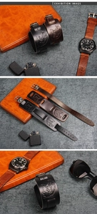 Macro detail of retro wide leather wristband featuring wolf and eagle embossed patterns