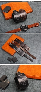 Close-up of leather bracelets featuring embossed wolf head and metal buckle detail