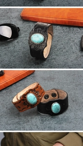 Detail view of vintage wide leather bracelet with embossed patterns and turquoise stone