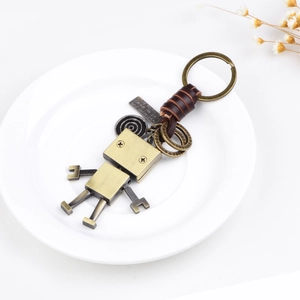 Porte-clés robot industriel vintage en alliage de bronze et lanière en cuir véritable