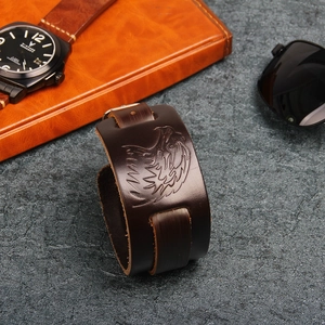Retro eagle embossed brown leather bracelet for men featuring a vintage punk style band