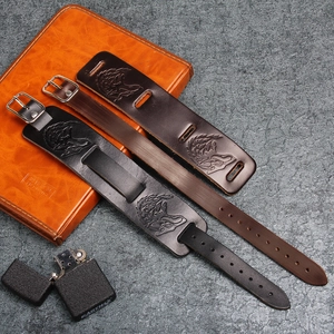 Rugged leather wristband featuring embossed wolf head and adjustable metal buckle