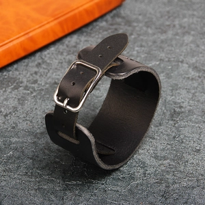 Retro black wide leather cuff bracelet with wolf head embossing and silver buckle closure