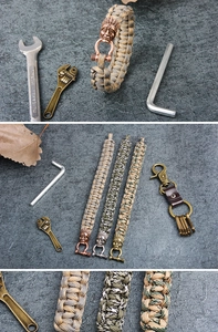 Detail of paracord survival bracelets with Indian head buckles in three metallic finishes