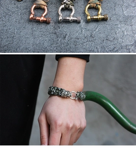 Detail of outdoor paracord bracelets with metal shackles in bronze, silver, and copper colors