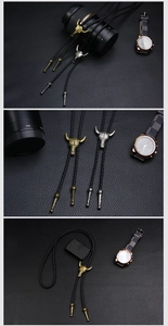 Nahaufnahme der Vintage-Bolo-Krawatte mit distressed Gold- und Silber-Stierkopf-Anhänger