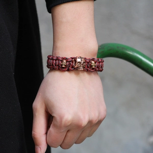 Handmade paracord survival bracelet with vintage copper skull charms for men and outdoors