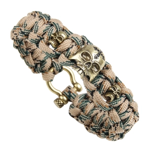 Tactical 7-strand paracord survival bracelet with bronze skull charms and U-shaped shackle