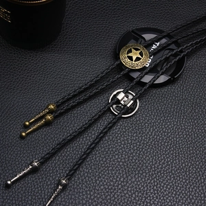Vintage western bolo tie featuring carved star pendant with braided black leather rope