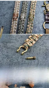 Detail of outdoor paracord bracelet with bronze skull bead and metal horseshoe buckle