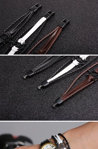 Detail of multilayer leather bracelet featuring a black metal nautical rudder wheel buckle