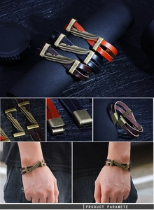 Detail of vintage leather bracelets with bronze feathers in black, brown, and orange tones