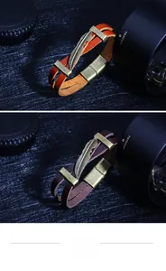 Detail view of retro bronze feather charms on premium double-layer leather bracelets