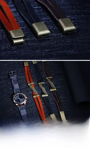 Macro detail of retro leather bracelets with bronze feathers and vintage metal clasps