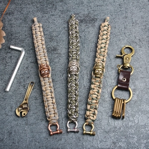 Outdoor survival paracord bracelets with skull charms and brass EDC keychain set