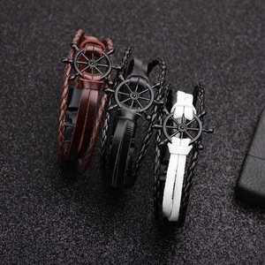 Nautical leather bracelet set with rudder wheel charms and braided multi-layer design