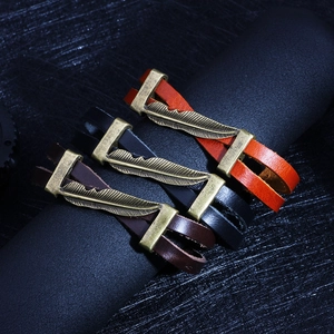 Three-piece retro leather bracelets with bronze feather charms in brown, black, and orange