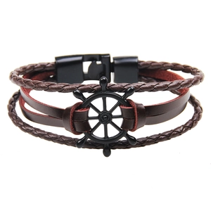 Multi-layer brown leather bracelet for men featuring a black metal helm charm and clasp