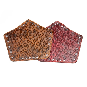 Retro studded wide leather wristband with embossed geometric pattern in brown and red