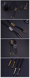 Detail der Vintage-Zikaden-Bolo-Krawatte mit Metallic-Finish und schwarzem Lederband