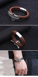Close-up of men's eagle leather bracelet showing braided texture and metal magnetic clasp