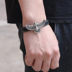 Punk eagle charm bracelet with black braided leather strap and magnetic clasp on wrist