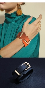 Detail of adjustable PU leather wide cuff bracelets with gold metal buckle closure