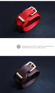 Detail view of red and brown PU leather bracelets with cross pattern and gold buckles
