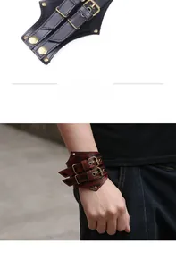 Detail view of vintage rock leather bracelets with dual buckles in black and brown leather