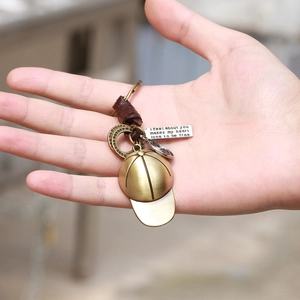 Vintage bronze baseball cap keychain with genuine leather rope and engraved metal tags