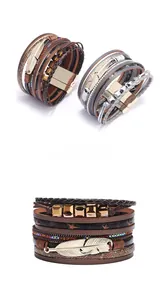 Detail of bohemian multilayer leather bracelets featuring metal feather charms and magnetic clasp
