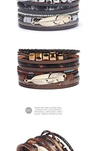 Close-up of bohemian multilayer leather bracelet with metal feather charms and rhinestones