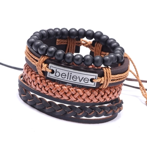 Mens four-piece layered bracelet set with believe engraved metal plate and braided leather