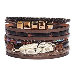 Multilayer leather wrap bracelet with golden metal feather and rhinestone charms