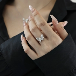 Exquisite S925 sterling silver butterfly ring with shimmering zircon on female hand