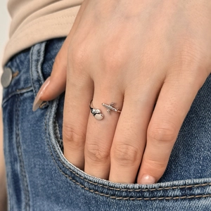 Minimalist S925 sterling silver open ring featuring airplane and heart motifs on model