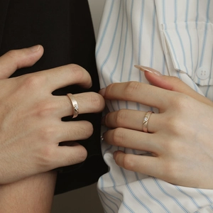 Close-up of S925 sterling silver couple rings with brushed rose gold finish and diamonds