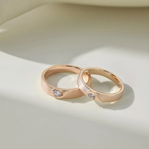 Detail of S925 sterling silver couple rings showing rose gold finish and matte texture