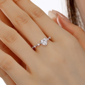 Close-up of S925 sterling silver ring featuring a heart-shaped zircon and side diamonds
