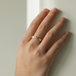 Close-up of rose gold plated S925 sterling silver ring with frosted finish and center stone