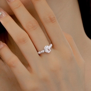 Exquisite S925 sterling silver ring with oval cut zircon and beaded band on finger