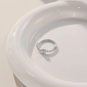Macro view of emerald cut square zircon ring set in polished 925 sterling silver