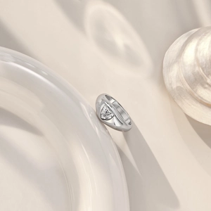 Macro detail of S925 sterling silver ring with sparkling heart-shaped zircon inlay