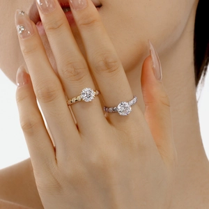 Detail of s925 silver rings with twisted band and round cut stones in gold and silver