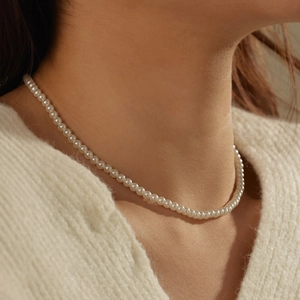 Elegant S925 silver pearl necklace with 4mm cream round beads on a female model