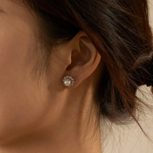 Elegant S925 silver flower pearl stud earrings with zircon accents worn by model
