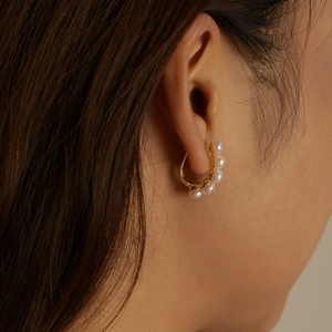 Elegant gold hoop earrings featuring five small freshwater pearls in French vintage style