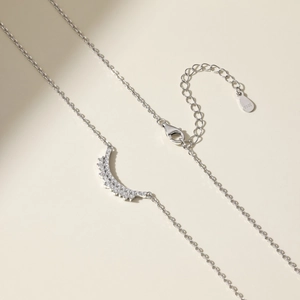 Detail of S925 sterling silver stamp on the moon pendant necklace with cubic zirconia